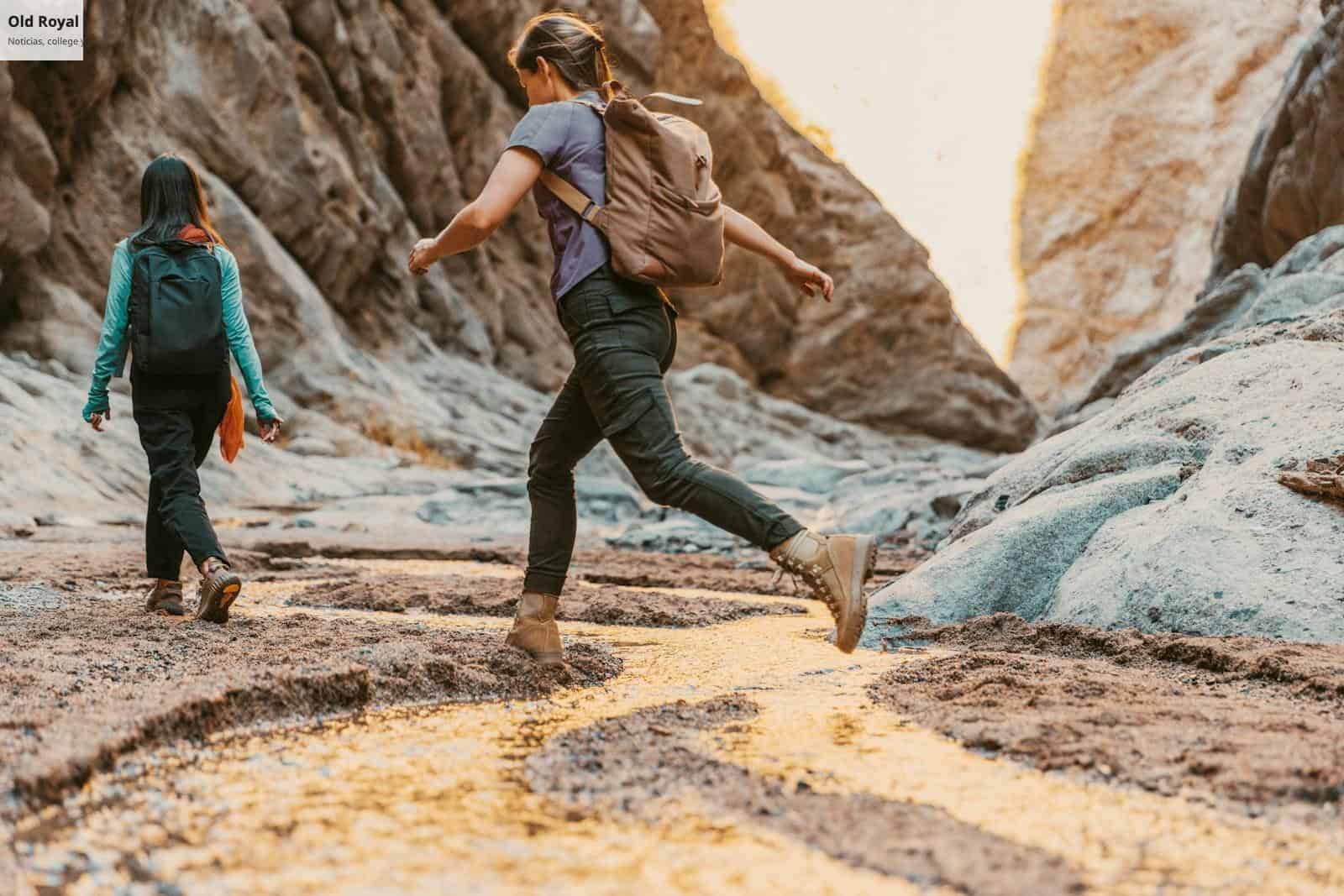 a couple of people that are walking in the dirt